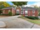 Stately brick home showcasing manicured lawn and classic architectural details at 248 Montrose Dr, Mcdonough, GA 30253