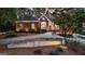 Elegant brick home with manicured landscaping, decorative lighting, and inviting walkway at 248 Montrose Dr, Mcdonough, GA 30253