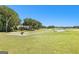 Expansive golf course view featuring lush green fairways and mature trees, creating a serene and picturesque landscape at 248 Montrose Dr, Mcdonough, GA 30253