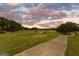 Scenic golf course view with lush green fairways and a tranquil pond, perfect for relaxation and recreation at 248 Montrose Dr, Mcdonough, GA 30253