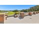 Stunning golf course view from elevated patio, featuring brick accents, white railings and scenic greenery at 248 Montrose Dr, Mcdonough, GA 30253