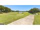 Scenic golf course with a calm pond and lush green fairways, ideal for golfing and enjoying nature at 248 Montrose Dr, Mcdonough, GA 30253