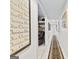 Bright hallway leading to a room with a recliner and a built-in bookshelf at 248 Montrose Dr, Mcdonough, GA 30253