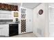 Bright kitchen featuring white cabinets, a built-in wine rack, and views of the backyard at 248 Montrose Dr, Mcdonough, GA 30253