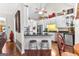 Bright kitchen with white cabinets, granite countertops, stainless steel appliances, and breakfast bar with seating at 248 Montrose Dr, Mcdonough, GA 30253