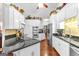 Well-equipped kitchen with stainless steel appliances, granite countertops, and white cabinets at 248 Montrose Dr, Mcdonough, GA 30253