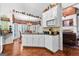Open kitchen and dining area with ample natural light, granite countertops, and modern appliances at 248 Montrose Dr, Mcdonough, GA 30253