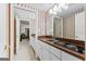 Small kitchenette featuring a sink, stovetop, white cabinetry, and striking red wallpaper for a retro feel at 248 Montrose Dr, Mcdonough, GA 30253