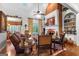 Inviting living room with brick fireplace, built-in shelves, and comfortable seating at 248 Montrose Dr, Mcdonough, GA 30253