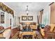 Cozy living room featuring hardwood floors, neutral paint, and ample natural light at 248 Montrose Dr, Mcdonough, GA 30253