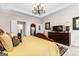 An inviting main bedroom with a tray ceiling, neutral colors, and carpeted floors at 248 Montrose Dr, Mcdonough, GA 30253