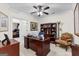 Home office with a large desk, ample shelving, and a comfortable sitting area for productive work at 248 Montrose Dr, Mcdonough, GA 30253