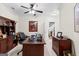 Well-lit home office with large desk, wooden accents, and a view leading to the basement entrance at 248 Montrose Dr, Mcdonough, GA 30253