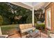 Covered patio with cushioned seating and a woven coffee table at 248 Montrose Dr, Mcdonough, GA 30253