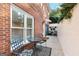 Outdoor patio with seating and greenery along brick walls at 248 Montrose Dr, Mcdonough, GA 30253
