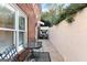 View of the patio with a table and chairs, surrounded by brick walls at 248 Montrose Dr, Mcdonough, GA 30253