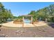 Beautifully landscaped pool area with comfortable seating and lush greenery, perfect for leisure and recreation at 248 Montrose Dr, Mcdonough, GA 30253
