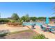 Inviting community pool area with stylish lounge furniture and verdant landscaping, ideal for summer relaxation at 248 Montrose Dr, Mcdonough, GA 30253