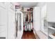 Well-organized walk-in closet with shelving, hanging rods, and natural light from a window at 248 Montrose Dr, Mcdonough, GA 30253