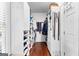 Spacious walk-in closet offers ample storage with custom shelving and hardwood flooring at 248 Montrose Dr, Mcdonough, GA 30253