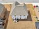 Aerial shot features a home with a patio area, lush backyard, and neighborhood surroundings at 445 Sawmill Trce, Hampton, GA 30228