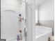 Shower and soaking tub with modern fixtures and stylish design at 445 Sawmill Trce, Hampton, GA 30228