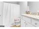Bathroom featuring a vanity with granite countertop, and shower with curtain at 445 Sawmill Trce, Hampton, GA 30228