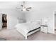Bright bedroom featuring a ceiling fan, plush carpet, and modern furnishings at 445 Sawmill Trce, Hampton, GA 30228