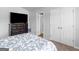 Bedroom featuring neutral walls, a bed, and double door closet at 445 Sawmill Trce, Hampton, GA 30228