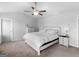 Bright bedroom featuring a ceiling fan, plush carpet, and modern furnishings at 445 Sawmill Trce, Hampton, GA 30228