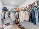 Walk-in closet with clothing racks, shelves, and various bags and shoes at 445 Sawmill Trce, Hampton, GA 30228