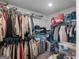 Organized walk-in closet providing ample storage with shelving and hanging space at 445 Sawmill Trce, Hampton, GA 30228
