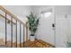 Inviting entryway with natural light, modern decor, and a charming 'Bee our guest' welcome mat at 445 Sawmill Trce, Hampton, GA 30228