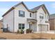 Beautiful two-story home featuring a brick facade, attached garage, and landscaped yard at 445 Sawmill Trce, Hampton, GA 30228