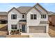 Charming two-story home with a well-manicured lawn and inviting front entrance at 445 Sawmill Trce, Hampton, GA 30228