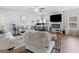 Bright and airy living room with comfortable seating, a fireplace, and a modern design at 445 Sawmill Trce, Hampton, GA 30228