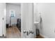 View of the powder room and laundry room from the hallway at 445 Sawmill Trce, Hampton, GA 30228