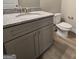 Bathroom featuring a gray vanity with granite countertop, wood-look flooring, and a toilet at 746 S. Bethany Rd., Locust Grove, GA 30248