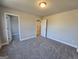 Bedroom featuring neutral paint, plush carpet, and doorway to walk-in closet at 746 S. Bethany Rd., Locust Grove, GA 30248