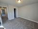 Bedroom featuring neutral paint, plush carpet, and view into the hallway at 746 S. Bethany Rd., Locust Grove, GA 30248
