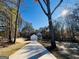 Charming home with a long driveway lined with trees and a two-car garage at 746 S. Bethany Rd., Locust Grove, GA 30248