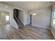 Open-concept view of the staircase and living room features neutral walls and floors and lots of natural light at 746 S. Bethany Rd., Locust Grove, GA 30248
