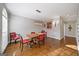 Dining room with hardwood floors, modern light fixture, and elegant chairs arranged around a wooden table at 2770 Stonehill Way, Cumming, GA 30041