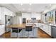 Spacious kitchen featuring granite countertops, stainless steel appliances, and a large center island at 2770 Stonehill Way, Cumming, GA 30041