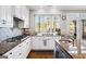 Kitchen featuring granite countertops, stainless steel appliances, and white cabinetry at 2770 Stonehill Way, Cumming, GA 30041