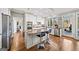 Beautiful kitchen with granite counters, stainless appliances, and an island with bar seating at 2770 Stonehill Way, Cumming, GA 30041