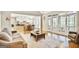 Inviting living space featuring a view into the kitchen, comfortable seating, and abundant natural light at 2770 Stonehill Way, Cumming, GA 30041