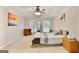 Bright main bedroom with a trey ceiling, neutral walls, and a ceiling fan at 2770 Stonehill Way, Cumming, GA 30041