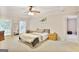 Spacious main bedroom with trey ceiling, neutral carpet, and a ceiling fan at 2770 Stonehill Way, Cumming, GA 30041