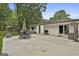 Backyard patio area with outdoor seating, a grill, and a sliding glass door entrance to the house at 306 N Meade Dr, Peachtree City, GA 30269